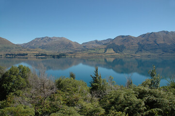 Fototapeta na wymiar Reflection in the water of Elfin Bay Queenstown New Zealand