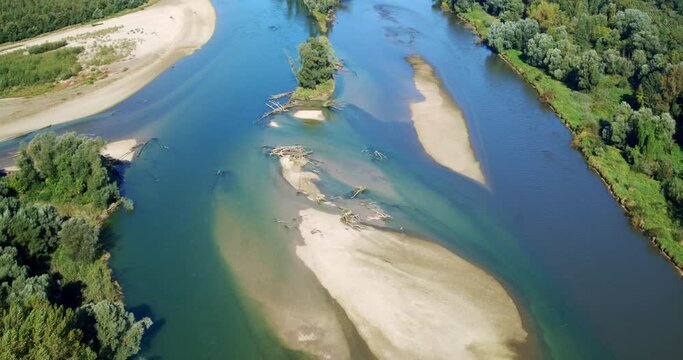 Aerial view of the natural and wild confluence of two rivers (the Mura and the  Drava)