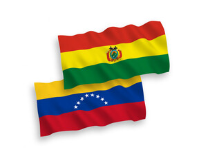 National vector fabric wave flags of Venezuela and Bolivia isolated on white background. 1 to 2 proportion.