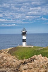 Fototapeta na wymiar Lighthouse in sunny day