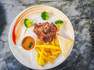 The arrangement of the steak on the plate