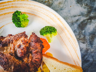 The arrangement of the steak on the plate