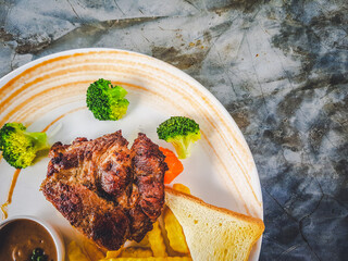 The arrangement of the steak on the plate