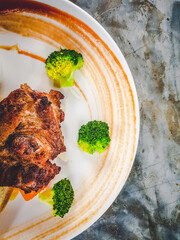 The arrangement of the steak on the plate