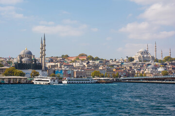 Fototapeta na wymiar Yeni Camii New Mosque left and Suleymaniye Mosque right in the Fatih district of European Istanbul. Galata Bridge can be seen foreground right