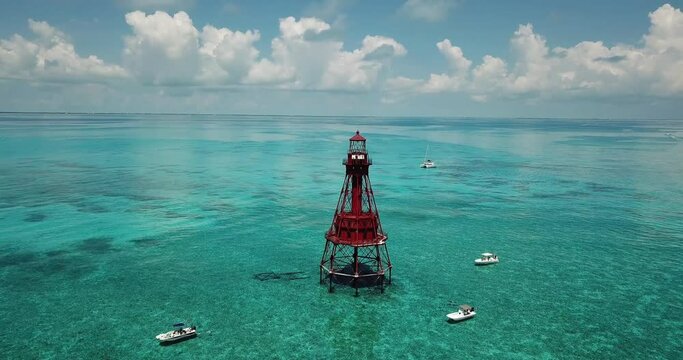 Push in drone shot of American Shoal Lighthouse 6.5 nautical miles off the coast of the Florida Keys near Sugarloaf Key,.