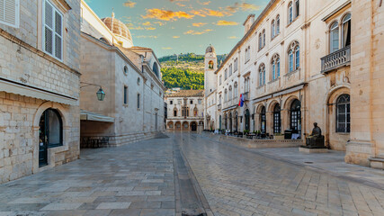 Fototapeta na wymiar One of the main streets of the old town of Dubrovnik overlooking Mount Srđ, Croatia.