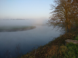 Naklejka na ściany i meble morning mist over the river