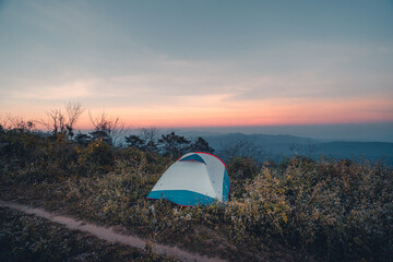 Pitch a tent on the mountain in the evening