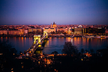 Fototapeta premium BUDAPEST, HUNGARY, January 01, 2020: Exterior shot of Bridge, Buildings and Danube River, Budapest, Hungary.