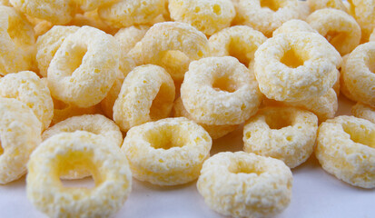 Corn rings on a white background. corn snack.