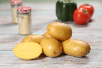 Potatoes on wooden background