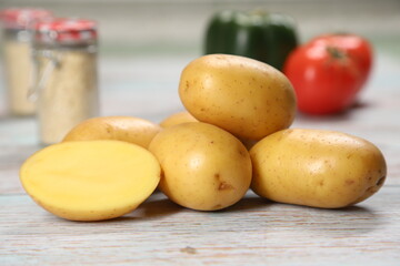 Potatoes on wooden background