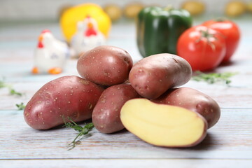 Potatoes on wooden background