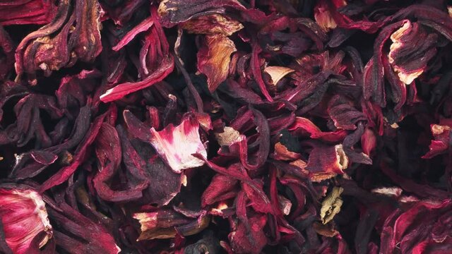 Rotation of hibiscus tea on the leaves. View from above.