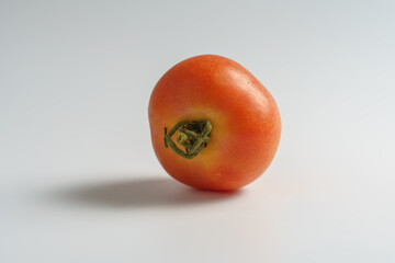 Ripe tomato on white background