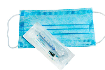 protective face mask and syringe for vaccination