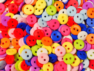 Background from multi-colored buttons. Close-up.