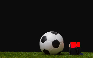 Football soccer referee equipment on green grass background