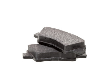 brake pads one on top of the other demonstrate the thickness of asbestos abrasive coating, new car...