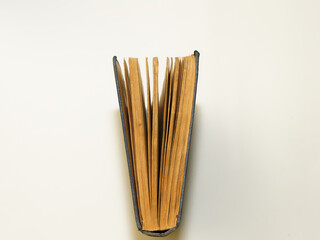 Opened antique book on a white background. View from above.