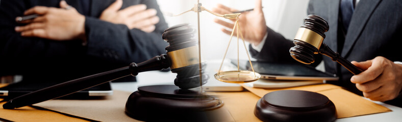 justice and law concept.Male judge in a courtroom on wooden table and Counselor or Male lawyer...