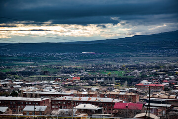 Fototapeta premium Dramatic high angle shot of Ashtarak town, Armenia in spring