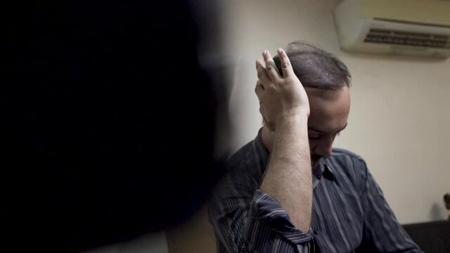 depressed and exhausted man in the office