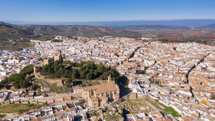 Bird view of Antequera, a white city in Andalusia, south Spain seen from above with castle and church