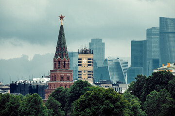 Moscow Russia 20 of May 2018: One Of The Towers Of Kremlin In Front Of Moscow-city Business Buildings On Background