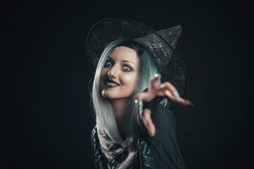 Beautiful young witch casting a spell