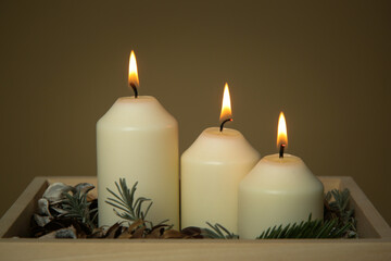 Wooden box christmas centerpiece. Simple and small home decoration with candles in wooden box.
