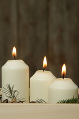 Wooden box christmas centerpiece. Simple and small home decoration with candles in wooden box.
