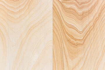 background with two vertical tiles of a brown stone with abstract shapes