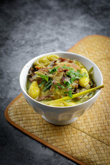 Smokey beef with tumeric and coconut milk also known as "DAGING SALAI MASAK LEMAK CILI API" in Malaysia. Common Minang food in Negeri Sembilan, Malaysia.