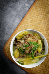 Smokey beef with tumeric and coconut milk also known as "DAGING SALAI MASAK LEMAK CILI API" in Malaysia. Common Minang food in Negeri Sembilan, Malaysia.