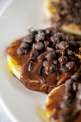 close up shoot of pancakes with chocolate topping