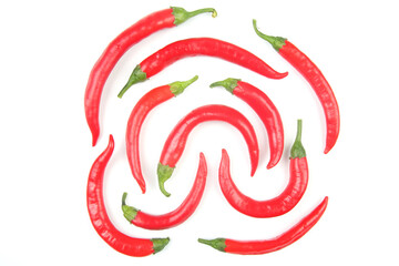 Red hot chili peppers on a white background. Vitamin vegetable food