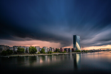 Thunderstorms and storms with weather phenomena over Frankfurt. Clouds over the skyline and the...