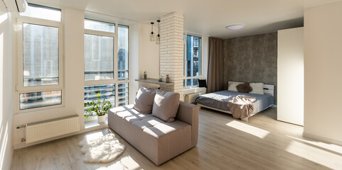 Sofa with pillows in room