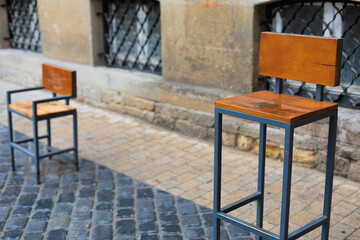 Photo of a brown chair in a white city