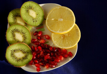 Kiwi, lemon slices and pomegranate seeds