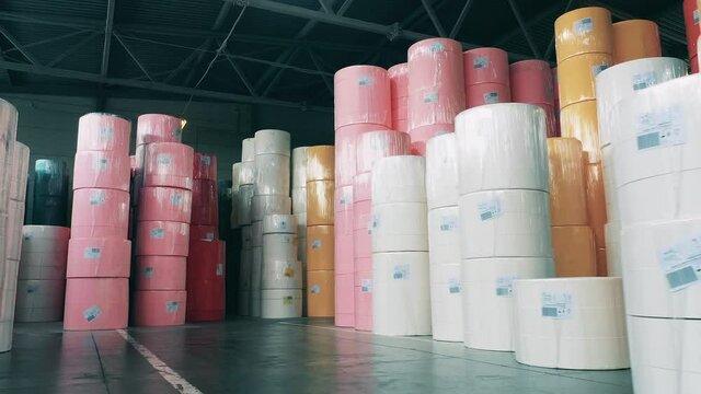Massive rolls of paper storaged in the factory unit