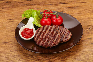 Grilled burger cutlet with sauce