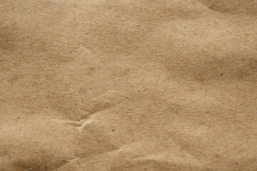 Brown crumpled paper recycled kraft sheet texture background