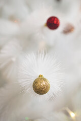 christmas and new year background with white christmas tree and golden glitter ball