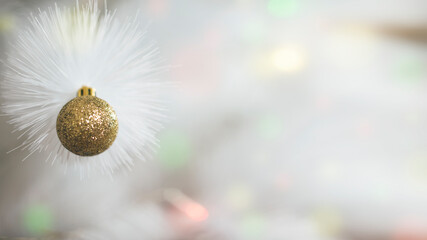 christmas and new year background with white christmas tree and golden glitter ball
