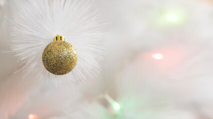 christmas and new year background with white christmas tree and golden glitter ball