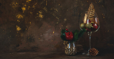 new year and christmas background with different glasses and toys for the christmas tree on a dark background