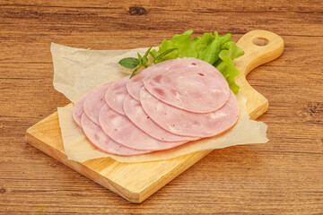 Slised ham snack over board